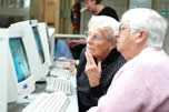 Two women looking at computer screen