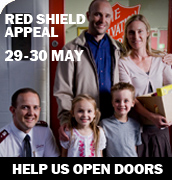 Red Shield Appeal ad - male Officer and man smiling